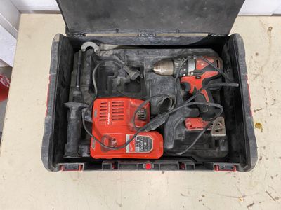 a tool box with tools in it sitting on the floor