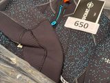a package of wetsuits in a plastic bag on a table