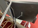 a metal chair that is sitting on top of a red carpet