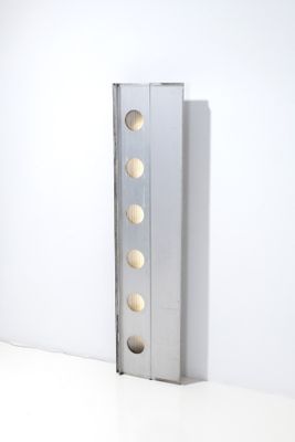 a metal object that is on a white surface