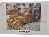 a picture of a picture of a car made out of wood