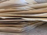 a stack of papers sitting on top of a table