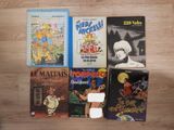 a lot of books that are sitting on the floor