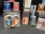 many different types of perfumes in a display case