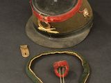 a picture of a hat and a necklace on a table