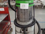 a vacuum that is sitting on a cart in a warehouse