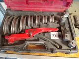 a tool in a tool box with a wren and some other tools