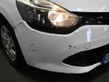 a white car that has been damaged and is sitting in a garage
