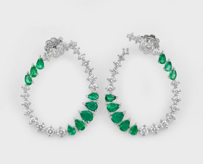 a pair of emerald and diamond hoop earrings