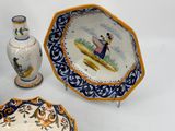 two plates and a vase on the table