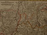 an old map of the country of england with a bird on top of it