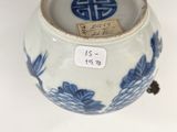 a blue and white vase with a blue design on it