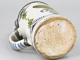 a close up of a coffee cup with a handle