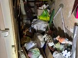 a room with a lot of clutter on the floor