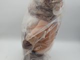 a bag of doughnuts wrapped in plastic on a table