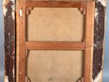 an old picture frame with a picture of a person in it