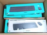 two boxes with a keyboard and mouse inside of them in a cardboard box