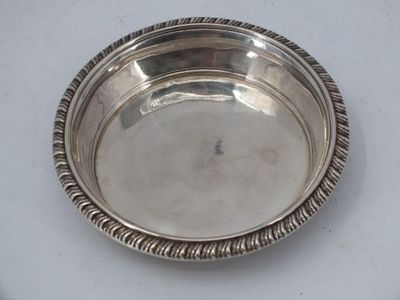 a silver plate on a table with a rope around it