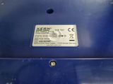 a close up of a blue box with a label on it