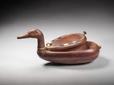 an image of a wooden duck sitting on top of a table