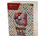 the box contains a pokemon trading card game with a red and white box