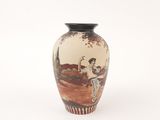 a vase with a picture of a man and a woman on it