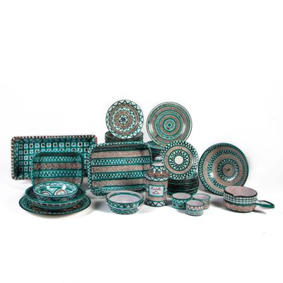 an image of a group of plates and bowls on a white surface