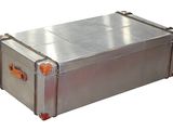 a large metal box with orange handles on a white background