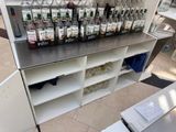 bottles of alcohol are lined up on a shelf in a store