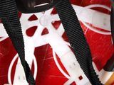 a close up of a red and white bowl with a camera attached to it