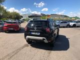 many cars parked in a parking lot with a sky background