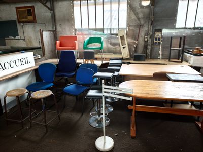 a room with a lot of chairs and tables in it