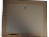 an old picture of a piece of paper with a hole in it