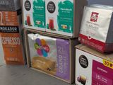 boxes of coffee are stacked on top of each other in a store