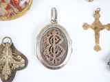 many different types of pendants on a white surface