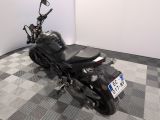 a motorcycle that is parked on a checkered floor