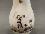 a white vase with a black and white picture on it
