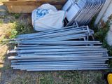 a pile of metal poles and a bag of bags