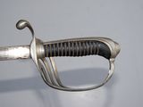 an image of a close up of a sword with a metal handle