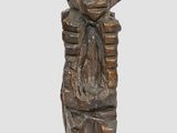an image of a bronze statue of a woman holding a baby
