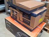 many boxes stacked on top of each other in a store