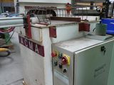 a machine that is sitting on a pallet in a warehouse
