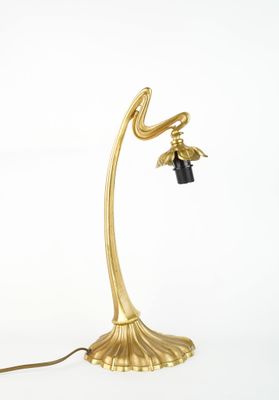 brass plated table lamp with a black glass shade and a brass plated base