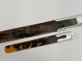 two knifes that are sitting on a table