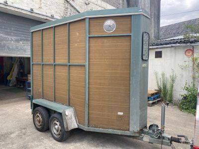 an image of a small trailer in a garage