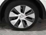 a close up of a white car with a black rim