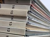 several books stacked on top of each other on a table