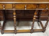a wooden table with a drawer on top of it