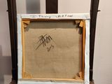 an old wooden easel with a painting on top of it
