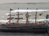 a ship in a bottle that is on a table